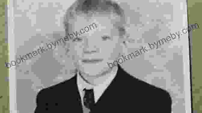 A Black And White Photograph Of James Dyson As A Young Boy, Wearing A White Shirt And Dark Pants, Looking Directly At The Camera With A Determined Expression. Invention: A Life James Dyson