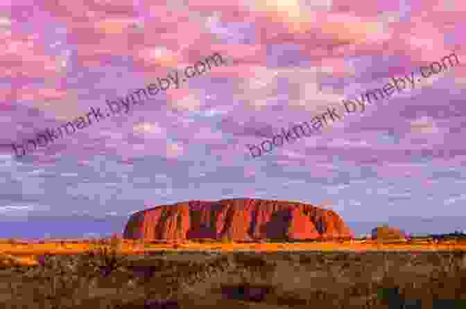 A Woman Sitting On A Rock, Watching A Vibrant Sunset Over The Australian Outback Tracks: One Woman S Journey Across 1 700 Miles Of Australian Outback