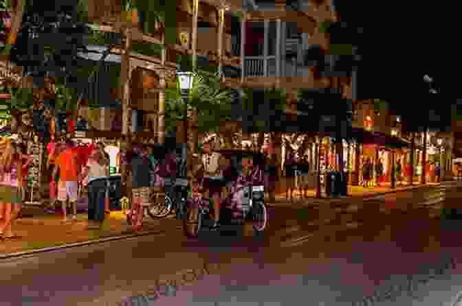 Nighttime Photograph Of Duval Street With People Walking And Enjoying The Nightlife. Key West S Duval Street (Images Of America)